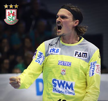 Handball-Torwart Jannick Green jubelt lautstark im gelb-blauen Trikot des SC Magdeburg und ballt die Faust.