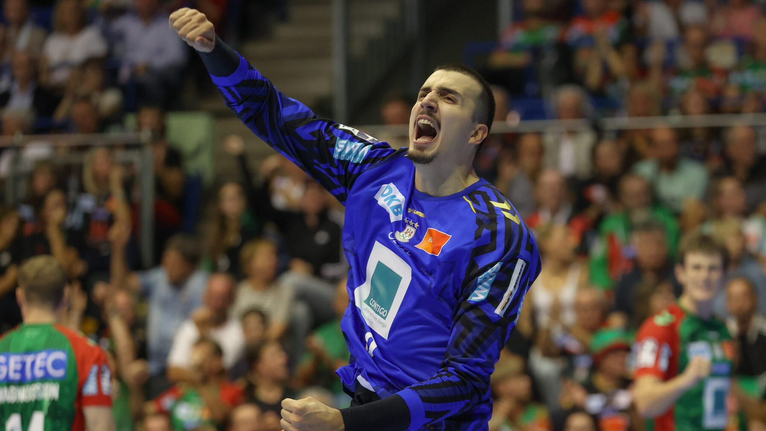 26.09.2026, xtgx, Handball Opel HBL, SC Magdeburg - SG BBM Bietigheim emspor, v.l. Matej Mandic (Magdeburg, 12) Jubelt ueber gehaltenen Ball, abgewehrt, gehalten, Torhueter